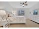 Main bedroom with queen bed, nightstands and dresser at 10358 Abaco Falls Dr, Englewood, FL 34223