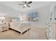 Bedroom with queen bed, nightstands, and dresser at 10358 Abaco Falls Dr, Englewood, FL 34223