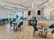 Community cafe with tables, chairs, and a coffee bar at 10358 Abaco Falls Dr, Englewood, FL 34223
