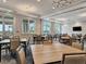 Spacious community room with tables and chairs, perfect for gatherings at 10358 Abaco Falls Dr, Englewood, FL 34223