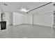 Spacious garage with overhead door and ample space at 10358 Abaco Falls Dr, Englewood, FL 34223
