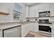 Kitchen features stainless steel appliances and granite countertops at 10358 Abaco Falls Dr, Englewood, FL 34223