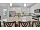 Granite countertop island kitchen with stainless steel appliances at 10358 Abaco Falls Dr, Englewood, FL 34223