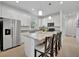 Modern kitchen features stainless steel appliances and white cabinets at 10358 Abaco Falls Dr, Englewood, FL 34223