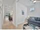 Bright living room with open floor plan and view of kitchen at 10358 Abaco Falls Dr, Englewood, FL 34223