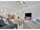 Bright living room features comfortable seating, large TV, and open floor plan at 10358 Abaco Falls Dr, Englewood, FL 34223