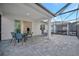 Covered patio with seating area and access to the pool at 10358 Abaco Falls Dr, Englewood, FL 34223