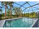 Refreshing screened pool perfect for relaxation and fun at 10358 Abaco Falls Dr, Englewood, FL 34223