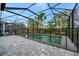 Private screened pool and patio area with paver deck at 10358 Abaco Falls Dr, Englewood, FL 34223
