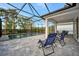 Relaxing screened pool and patio with comfortable seating at 10358 Abaco Falls Dr, Englewood, FL 34223
