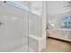 Large walk-in shower with glass enclosure and bench at 10358 Abaco Falls Dr, Englewood, FL 34223