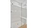 Walk-in shower with glass enclosure and bench at 10358 Abaco Falls Dr, Englewood, FL 34223