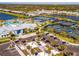 Aerial view of community with pool, tennis courts, and clubhouse at 10426 Abaco Falls Dr, Englewood, FL 34223