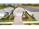 Aerial view of three homes with paver driveways at 10426 Abaco Falls Dr, Englewood, FL 34223