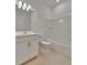 Bathroom with single vanity and bathtub at 10426 Abaco Falls Dr, Englewood, FL 34223