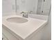 Bathroom vanity with a white countertop and chrome faucet at 10426 Abaco Falls Dr, Englewood, FL 34223