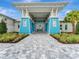 Beachwalk community clubhouse with inviting entrance and blue exterior at 10426 Abaco Falls Dr, Englewood, FL 34223