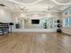 Fitness studio with large mirror and wood flooring at 10426 Abaco Falls Dr, Englewood, FL 34223