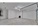 Clean and spacious garage with painted walls and concrete flooring at 10426 Abaco Falls Dr, Englewood, FL 34223