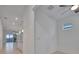 Bright and airy interior hallway with views into the living area at 10426 Abaco Falls Dr, Englewood, FL 34223