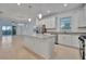 Modern kitchen with stainless steel appliances and granite countertops at 10426 Abaco Falls Dr, Englewood, FL 34223