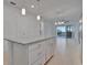 Kitchen island with granite countertops and stainless steel appliances at 10426 Abaco Falls Dr, Englewood, FL 34223
