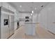 Open concept kitchen with stainless steel appliances and granite countertops at 10426 Abaco Falls Dr, Englewood, FL 34223