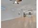 Large living room with tile floors and open concept kitchen at 10426 Abaco Falls Dr, Englewood, FL 34223