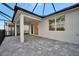 Covered patio with access to the interior and a view of the pool at 10426 Abaco Falls Dr, Englewood, FL 34223