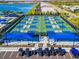 Beachwalk pickleball courts with multiple games in progress and shade structures at 10426 Abaco Falls Dr, Englewood, FL 34223