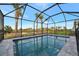 Relax and enjoy the view from this screened-in pool at 10426 Abaco Falls Dr, Englewood, FL 34223