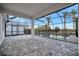 Enjoy this relaxing view of the pool and patio area, complete with a screened enclosure at 10426 Abaco Falls Dr, Englewood, FL 34223