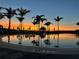 Relaxing resort-style pool at sunset at 10426 Abaco Falls Dr, Englewood, FL 34223