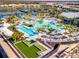Beachwalk resort-style pool with expansive deck, lap lanes, and waterfall feature at 10426 Abaco Falls Dr, Englewood, FL 34223
