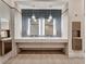 Modern restroom with double vanity and sleek tile at 10426 Abaco Falls Dr, Englewood, FL 34223