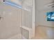 Large walk-in shower with glass enclosure and built-in seat at 10426 Abaco Falls Dr, Englewood, FL 34223