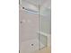 Bright walk-in shower with glass enclosure and built-in seat at 10426 Abaco Falls Dr, Englewood, FL 34223