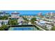 Coastal community with a tennis court and a picturesque ocean view in the background at 1200 E Peppertree Ln # 307, Sarasota, FL 34242
