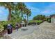 Outdoor grilling area with multiple grills and patio seating at 1200 E Peppertree Ln # 307, Sarasota, FL 34242