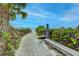 Beach walkway with bench; peaceful and scenic at 1200 E Peppertree Ln # 307, Sarasota, FL 34242