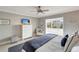 Spacious bedroom with a king-size bed and access to a balcony at 1200 E Peppertree Ln # 307, Sarasota, FL 34242