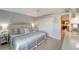 Calming bedroom with a king-size bed and ocean decor at 1200 E Peppertree Ln # 307, Sarasota, FL 34242