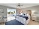 Bright bedroom with a seaside aesthetic and a cozy window nook overlooking the city at 1200 E Peppertree Ln # 307, Sarasota, FL 34242