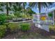 Community entrance sign with landscaping and fountain at 1200 E Peppertree Ln # 307, Sarasota, FL 34242