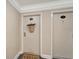 Well-lit condo entry with neutral walls and a welcome mat at 1200 E Peppertree Ln # 307, Sarasota, FL 34242