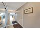Bright condo entry with mirrored closet doors and view of living area at 1200 E Peppertree Ln # 307, Sarasota, FL 34242
