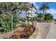 Attractive building exterior with lush landscaping and a welcoming entrance at 1200 E Peppertree Ln # 307, Sarasota, FL 34242