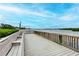 Fishing pier with benches overlooking waterway at 1200 E Peppertree Ln # 307, Sarasota, FL 34242
