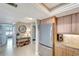 Bright, modern kitchen with stainless steel appliances, granite countertops, and tile flooring at 1200 E Peppertree Ln # 307, Sarasota, FL 34242