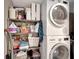Laundry room with washer, dryer, and ample storage shelving at 1200 E Peppertree Ln # 307, Sarasota, FL 34242